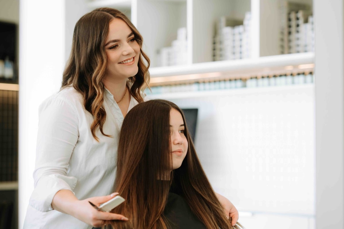 Woman getting her hair cut and styled in Wellington hair salon