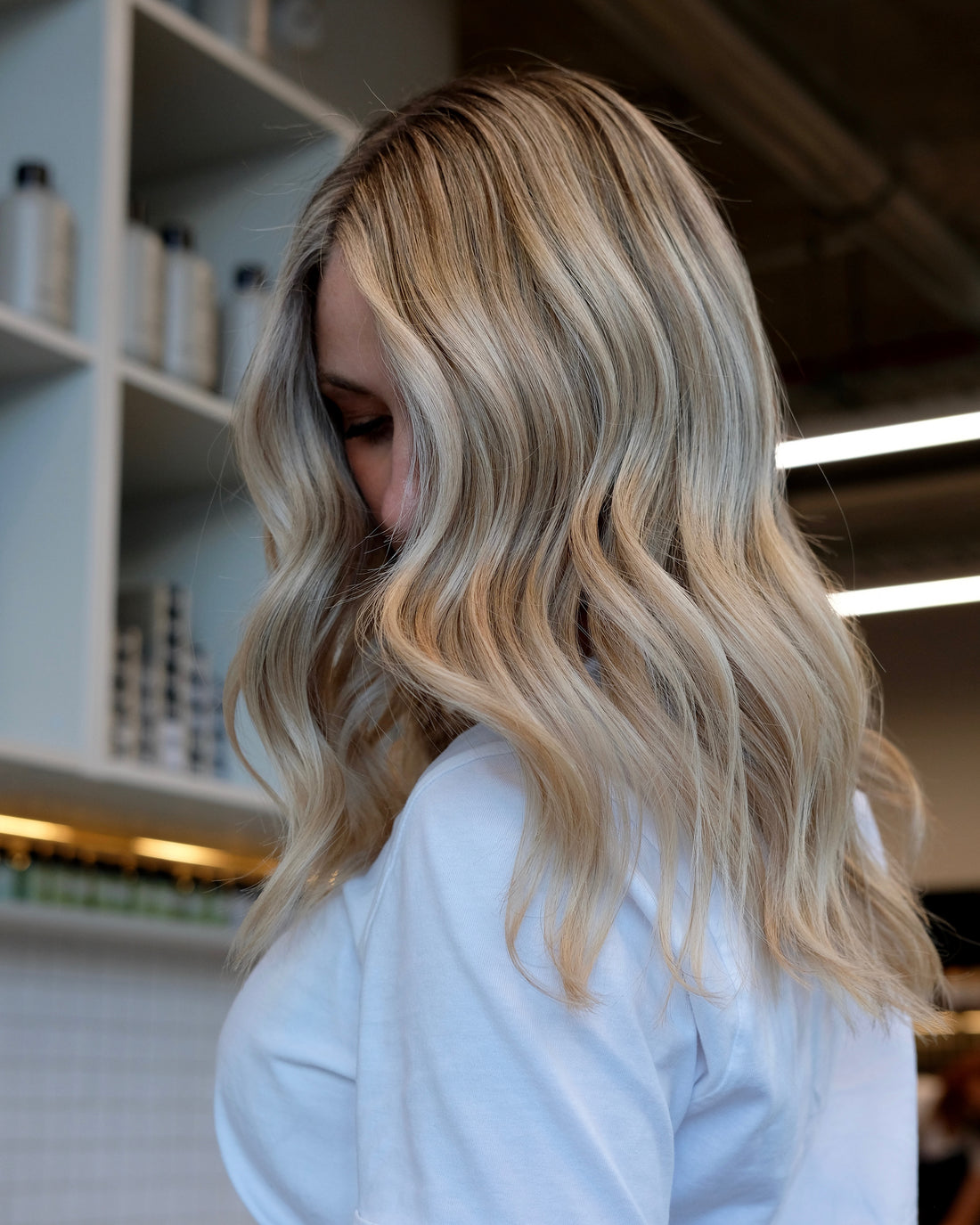 Balayage on long blonde hair, the sun kissed look by Badaro Wellington