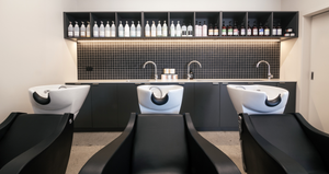 Inside our beauty salon, washing basins and collection of sustainable hair care products. 